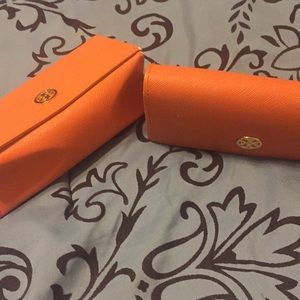TWO Tory Burch glass cases
